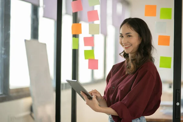 stock image Asian business woman looking at financial documents