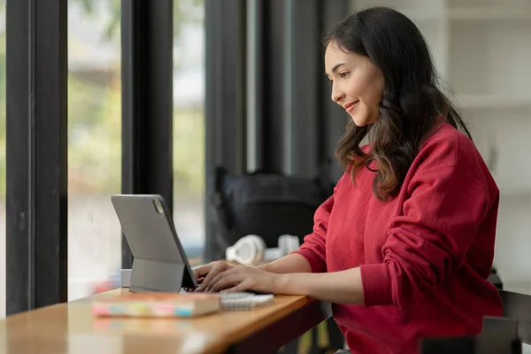 stock image Asian business woman looking at financial documents