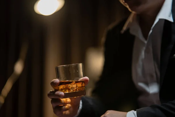 Businessman Sitting Holding Glass Whiskey Drink Whiskey Liquor Store Room — Stock Photo, Image