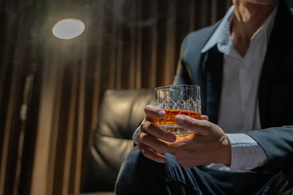 Businessman Sitting Holding Glass Whiskey Drink Whiskey Liquor Store Room — Stock Photo, Image