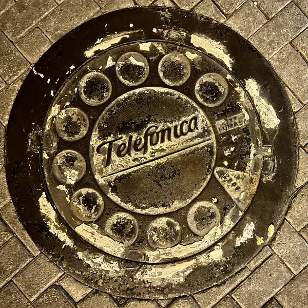 stock image Ancient geometric artwork on an old manhole cover seen from above. High Angle View. Lima, Peru