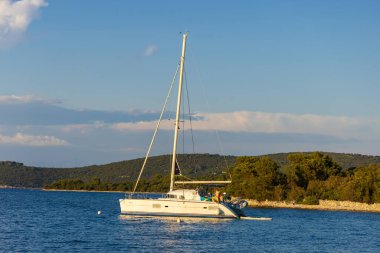 A sailing boat in the evening light near Veli Rat village, the Adriatic Sea, Croatia