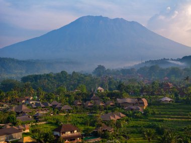 Aerial view of the countryside of Sidemen region with the background of Mount Agung, Bali, Indonesia clipart