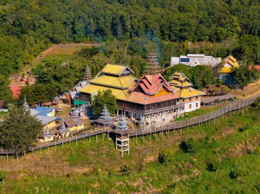 Aerial view of the Bamboo Bridge and Buddhist temple in northern Thailand near Mae Hong Son clipart