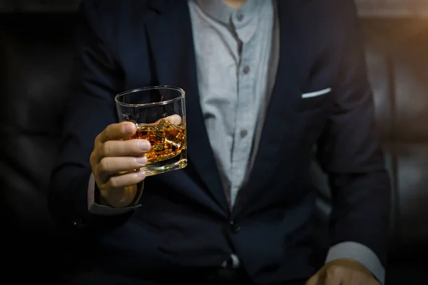 stock image Closeup businessmen holding a glass of whiskey