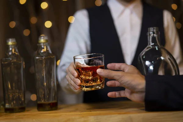 stock image Closeup businessmen holding a glass of whiskey