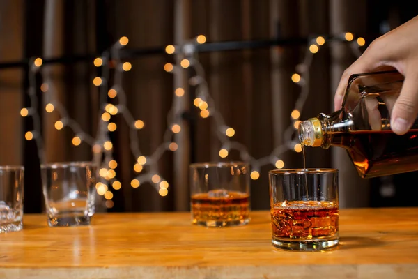 stock image Closeup businessmen holding a glass of whiskey