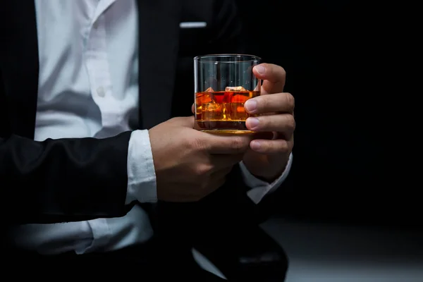 stock image Closeup businessmen holding a glass of whiskey