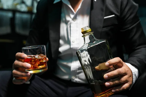 stock image Closeup businessmen holding a glass of whiskey