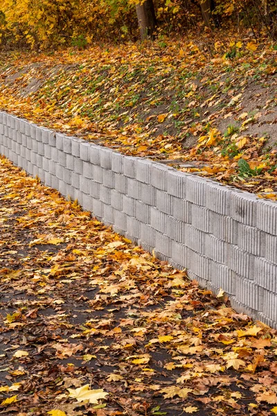Retaining Wall Made Concrete Elements Protects Roadway Pavement Sliding Slope Fotos de stock