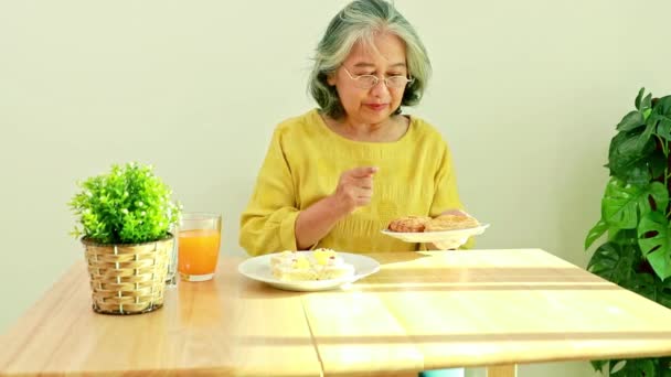 Elderly Woman Enjoys Sweet Cakes Sweet Chicken Pies Snacks Lunch — Vídeos de Stock