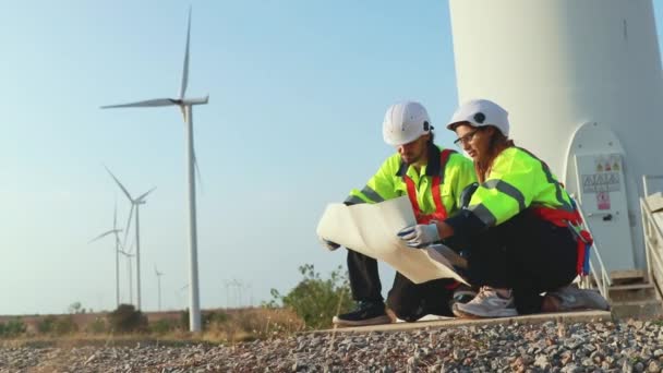Teamwork Two Caucasian Technicians Inspect Stands Analyzing Wind Power Station — 图库视频影像