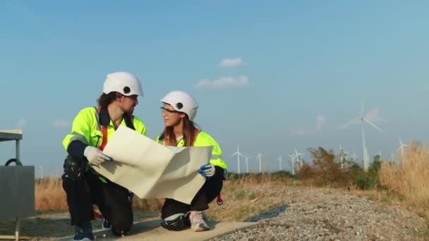 Teamwork Two Caucasian Technicians Inspect Stands Analyzing Wind Power Station — Video Stock
