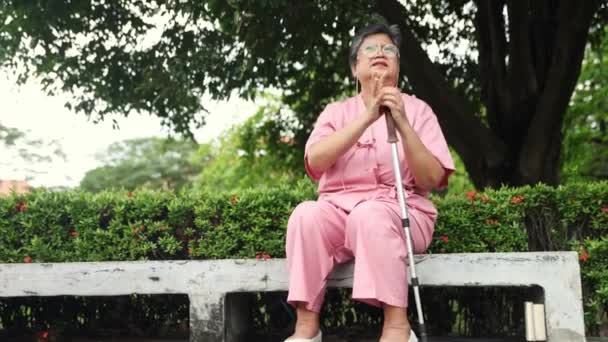 Elderly Woman Congenital Disease Holding Walker Sits Irritated Thinking Something — Stock Video