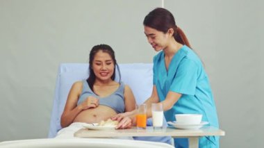 Hemşireler hamile kadınlara bakar doğum yapar, yemek hazırlar ve sofraya yemek tepsileri koyar. Hamile kadınlar besleyici meyveler yer hamileliklerini besler ve sağlıklarını korur..