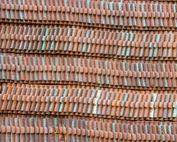 brown roof tiles Put the stacks in a row.