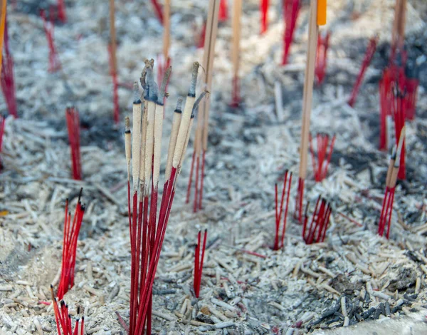 stock image The small incense sticks were extinguished, which were planted on several pots.