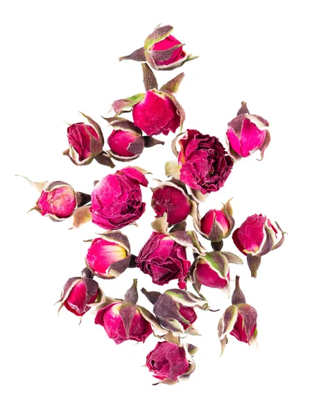 Heap of dry tea roses buds isolated on white background. Rose flower tea. Phnom Penh rose tea. Clipping path. Top view