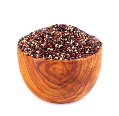 Quinoa seeds in wooden bowl, isolated on white background. Mix of white, red and black quinoa