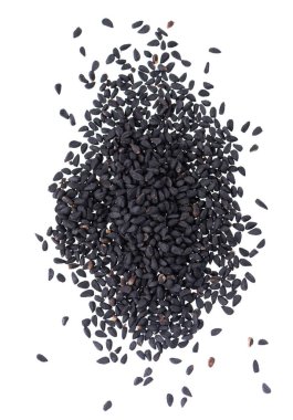 Beyaz arka planda siyah kimyon tohumları. Bir yığın siyah nigella tohumu. Nigella sativa. Üst görünüm