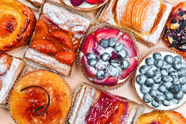 Assorted Glazed Fruit Dessert Cakes Stock Image