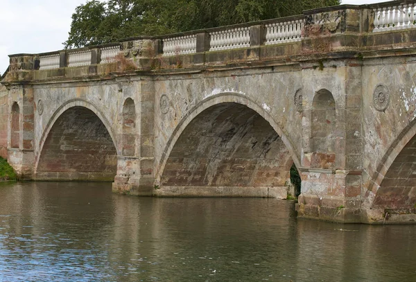 Old stone arched river bridge