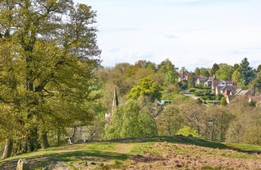 Church and village scene in Leicestershire, UK                    clipart