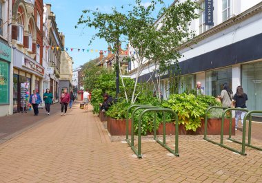 Deserted high street with foliage planters    clipart