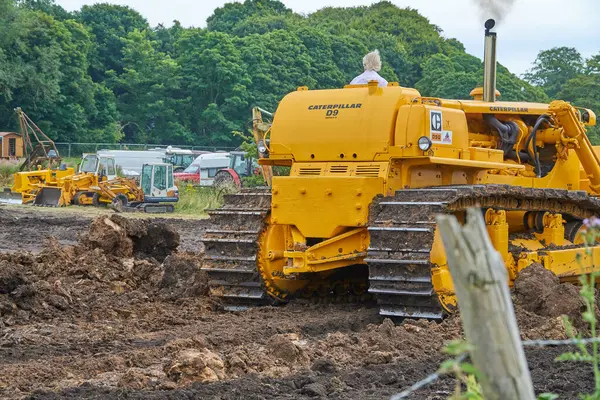 stock image D9 Caterpillar bulldozer driving away