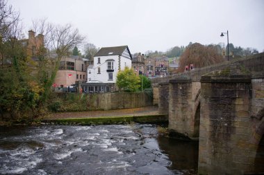 River and town scene in Matlock, Derbyshire, UK clipart