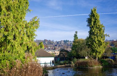 Park and town scene in Derbyshire, UK clipart