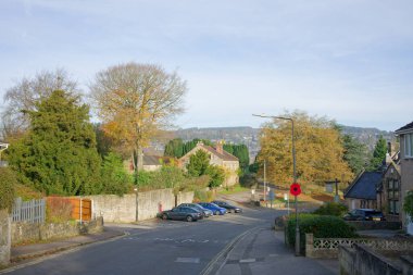 Quiet village road scene in Derbyshire, UK clipart