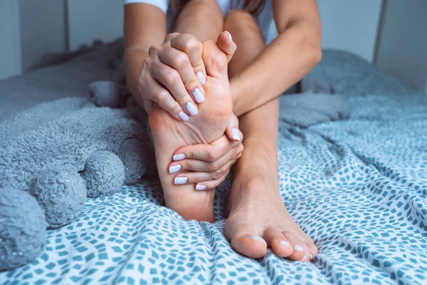 Woman Suffering Feet Pain Feet Ache Massaging Painful Foot Leg ロイヤリティフリーのストック画像