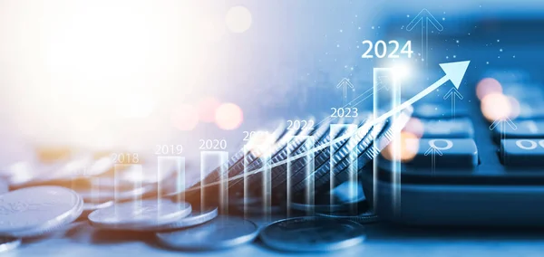 Coin drop 2024 new year business growth chart, positive indicator 2024, global company competitiveness, businessman calculating financial data for long term investment.