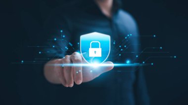 Cybersecurity concept, personal data protection and network security. Businessman touching key protecting business and financial data on tablet, secure internet access, security encryption.
