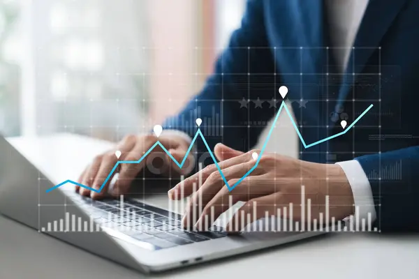 Businessman use laptop and tablet analyzing company growth, future business growth arrow graph, development to achieve goals, business outlook, financial data for long term investment.