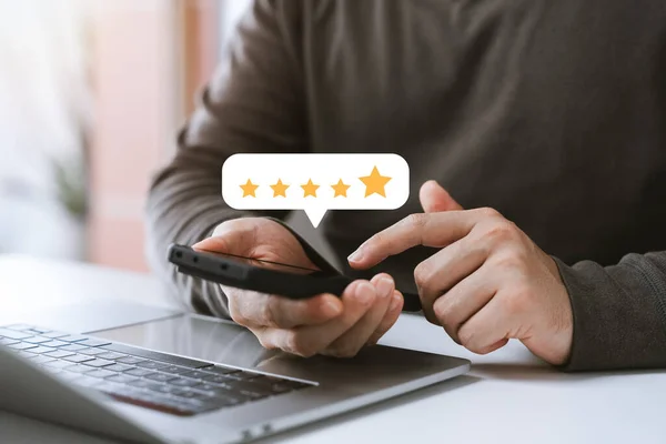customer satisfaction survey concept business people use smartphone Touch the happy smiley icon. Satisfied. 5 stars. Service experience rating. online application Satisfaction Review best quality.