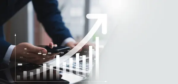 Businessman use laptop and tablet analyzing company growth, future business growth arrow graph, development to achieve goals, business outlook, financial data for long term investment.