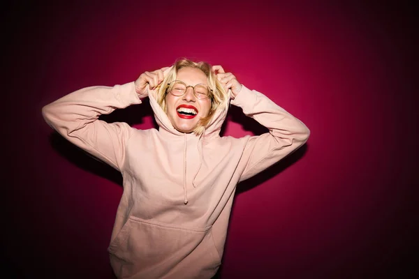 Happy Young Blond Woman Laughing While Standing Front Magenta Background — Fotografia de Stock