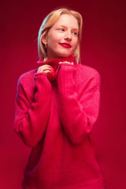 Portrait of a happy woman laughing. Viva magenta.