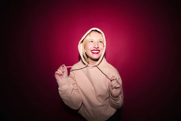 stock image A happy young woman laughing. Viva magenta, color of the year.