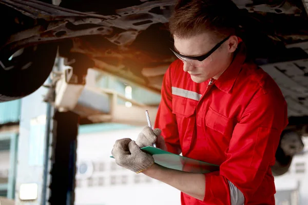 Mechanic Red Uniform Work Lifted Vehicle Inspect Car Engine System — Stock Photo, Image