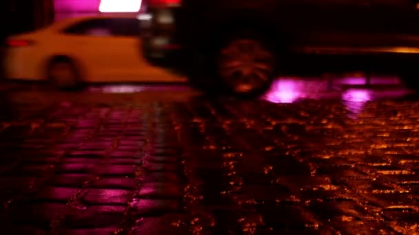 Cars Drive Pink Lit Cobblestone Road Rain Shooting Level Wheels — Stock Video