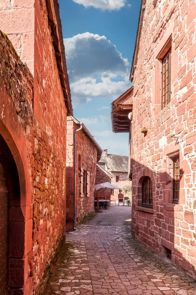 Narrow street in the medieval village of Collonges-la-Rouge, in Correze, in Nouvelle-Aquitaine, France