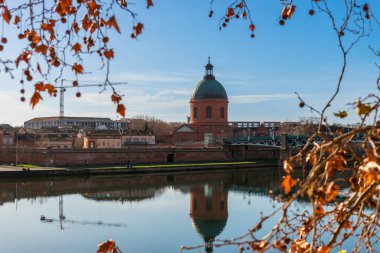 Grave Hospital and its reflection on the Garonne river, in Toulouse, Haute Garonne, Occitanie, France