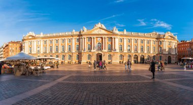 Tourists and market Place du Capitole in Toulouse in Haute Garonne, Occitanie, France clipart