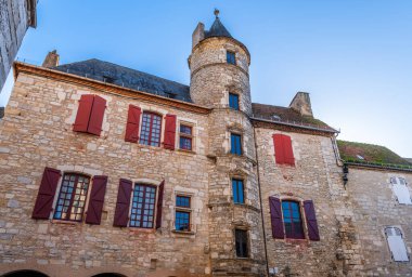 The Place de la Halle and the Fabri hotel, in Martel, in the Lot, in Occitanie, France clipart