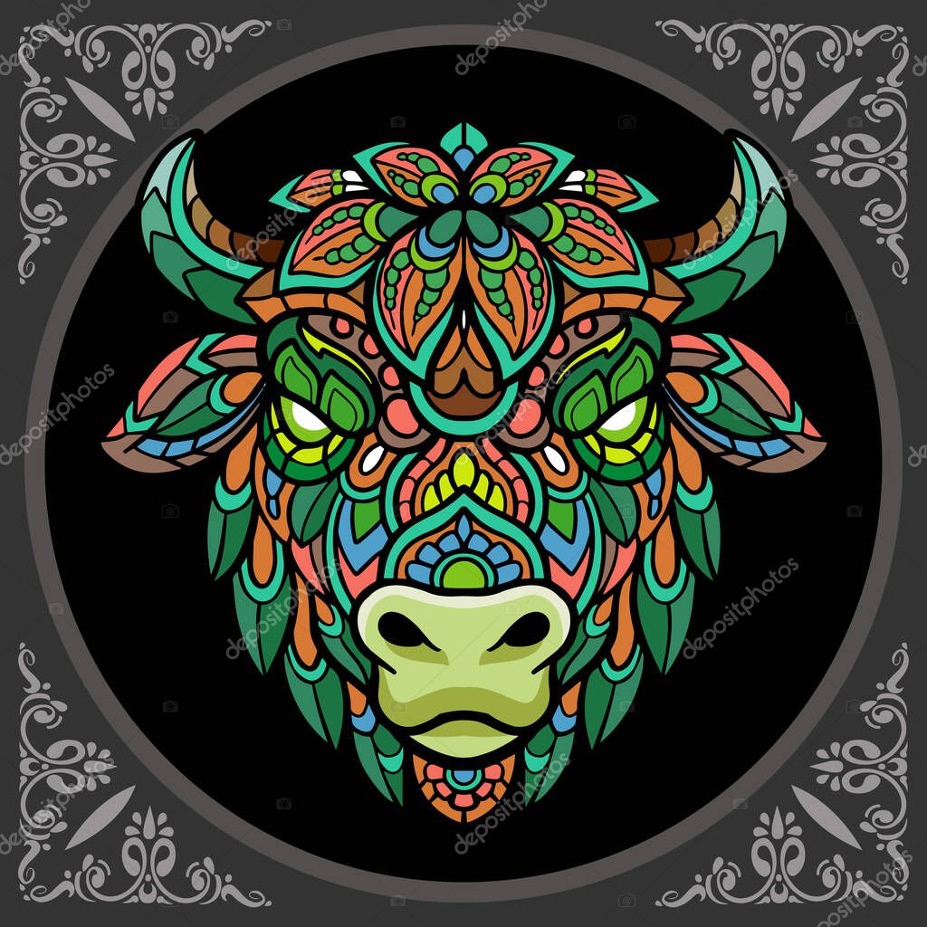 Colorful bison head mandala arts isolated on black background.