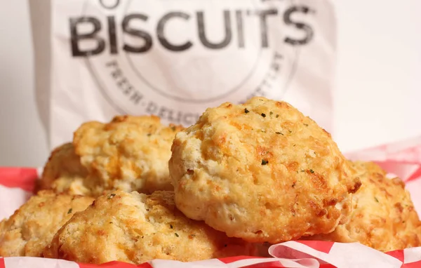 Garlic Cheese Biscuits With Biscuit Sign in Background Shallow DOF