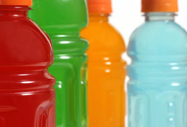 Bottles of Colorful Sports Drinks on White